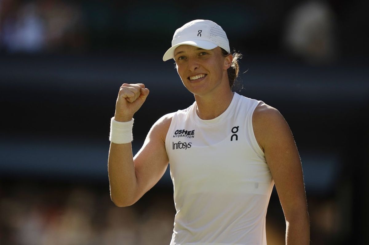 Jul 10, 2025; Wimbledon, United Kingdom; Iga Swiatek of Poland celebrates winning her match against Belinda Bencic of Switzerland on day 11 at All England Lawn Tennis and Croquet Club. Mandatory Credit: Susan Mullane-Imagn Images