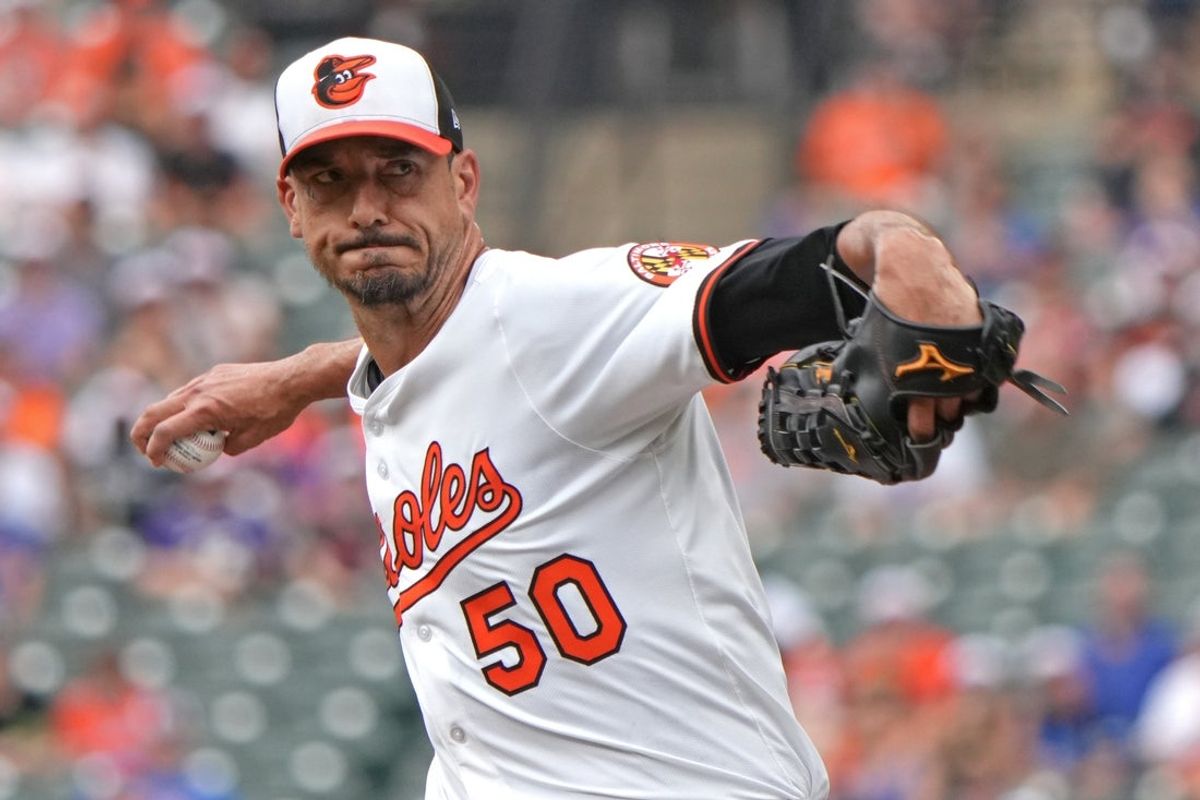 Jul 10, 2025; Baltimore, Maryland, USA;  Baltimore Orioles pitcher Charlie Morton (50) delivers in the first inning  against the New York Mets  at Oriole Park at Camden Yards. Mandatory Credit: Mitch Stringer-Imagn Images