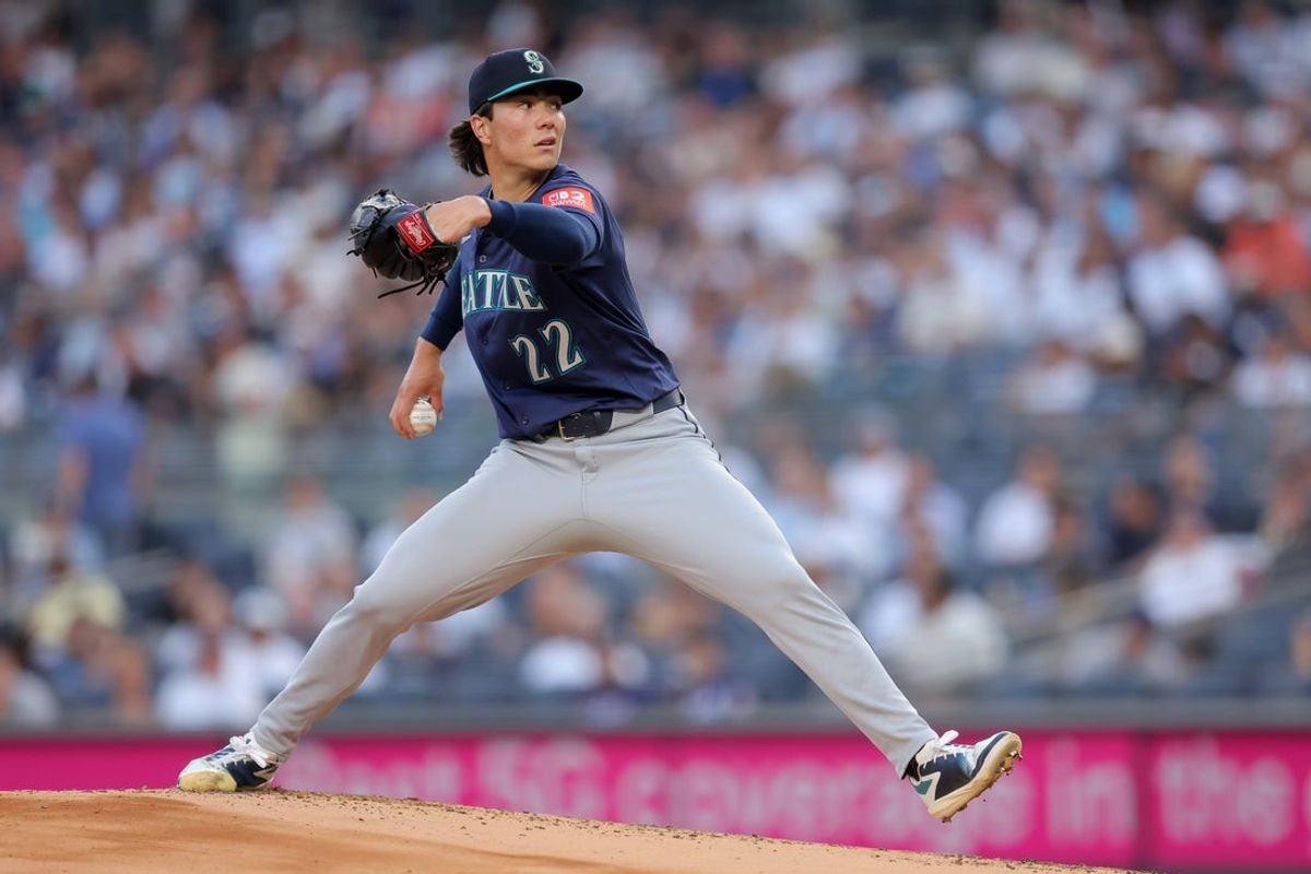 Jul 10, 2025; Bronx, New York, USA; Seattle Mariners starting pitcher Bryan Woo (22) pitches against the New York Yankees during the first inning at Yankee Stadium. Mandatory Credit: Brad Penner-Imagn Images