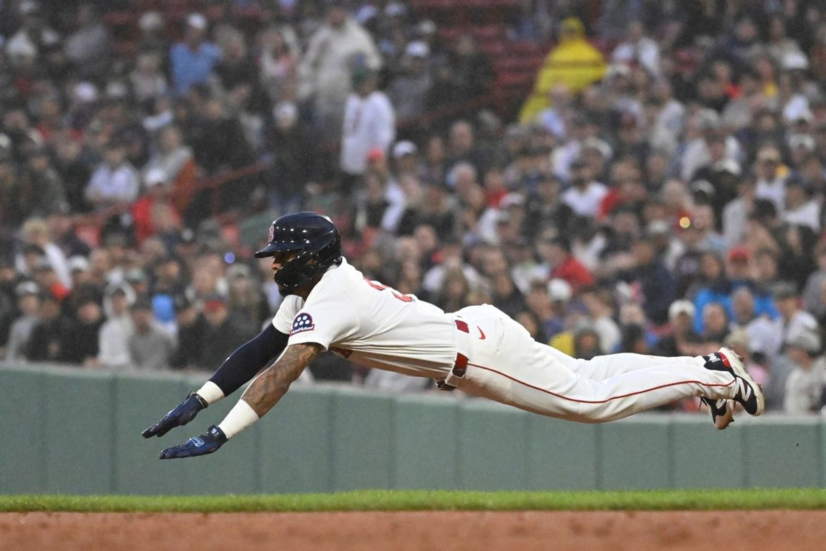Jul 10, 2025; Boston, Massachusetts, USA; Boston Red Sox center fielder Ceddanne Rafaela (3) dives into second base during the third inning against the Tampa Bay Rays at Fenway Park. Mandatory Credit: Eric Canha-Imagn Images