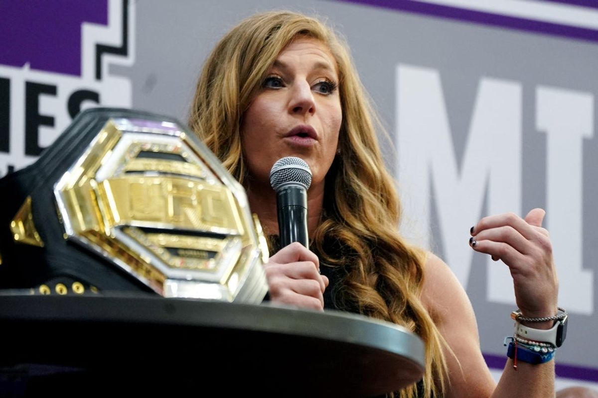 UFC champion Kayla Harrison answers an interview question for the Middletown Now podcast during a homecoming rally, Thursday, July 10, 2025, at Middletown High School in Middletown.