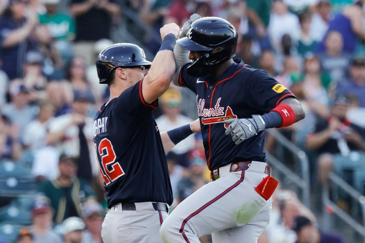 Jul 10, 2025; West Sacramento, California, USA; Atlanta Braves left fielder Jurickson Profar (7) celebrates with catcher Sean Murphy (12) after hitting a two run home run during the fourth inning against the Athletics at Sutter Health Park. Mandatory Credit: Sergio Estrada-Imagn Images