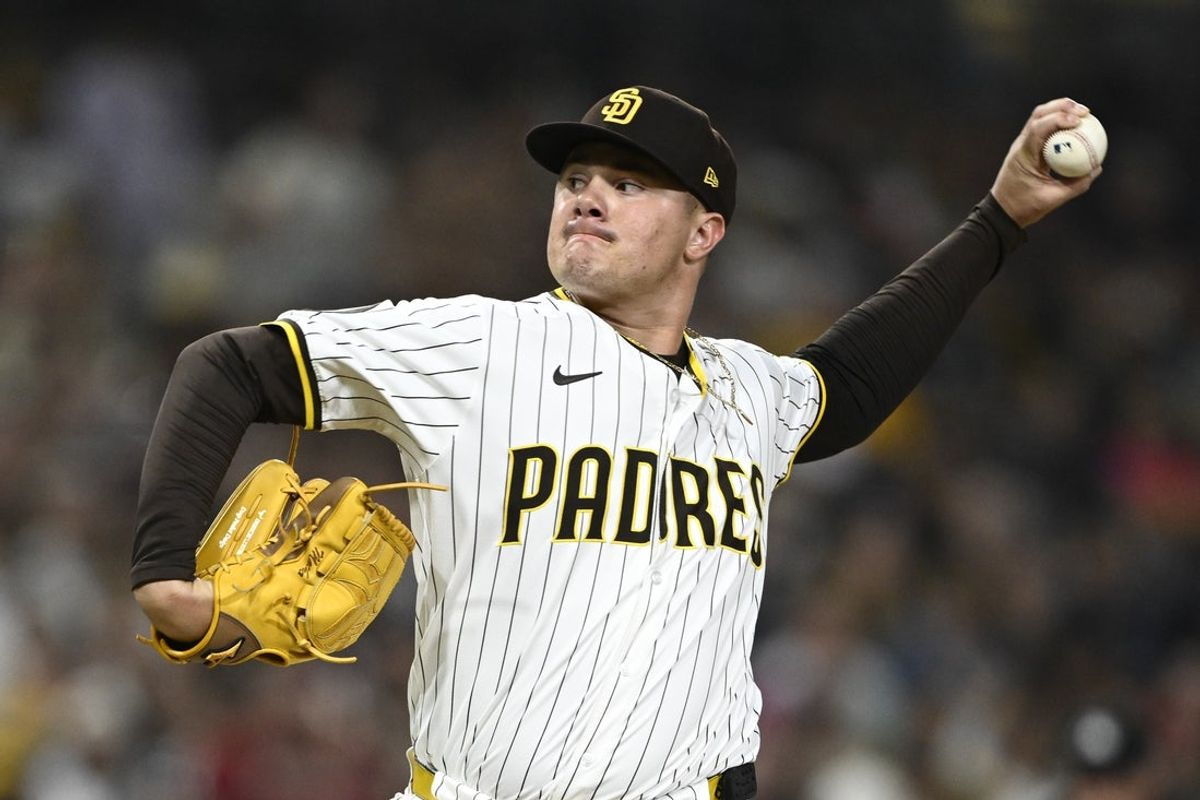 Jul 10, 2025; San Diego, California, USA; San Diego Padres relief pitcher Adrian Morejon (50) delivers during the seventh inning against the Arizona Diamondbacks at Petco Park. Mandatory Credit: Denis Poroy-Imagn Images a