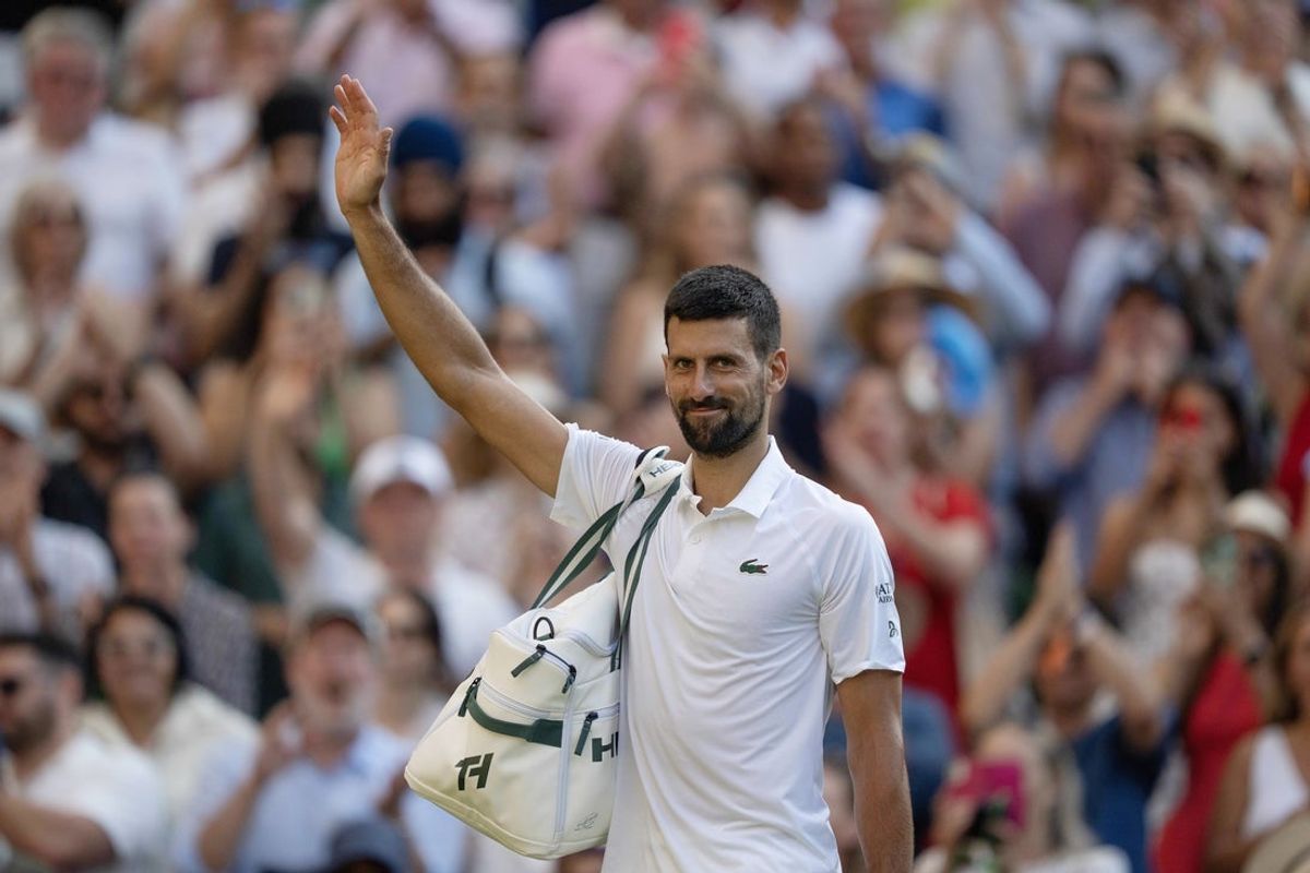 Jul 11, 2025; Wimbledon, United Kingdom; Novak Djokovic of Serbia leaves the court after losing his match to Jannik Sinner of Italy after their match on day 12 at All England Lawn Tennis and Croquet Club. Mandatory Credit: Susan Mullane-Imagn Images
