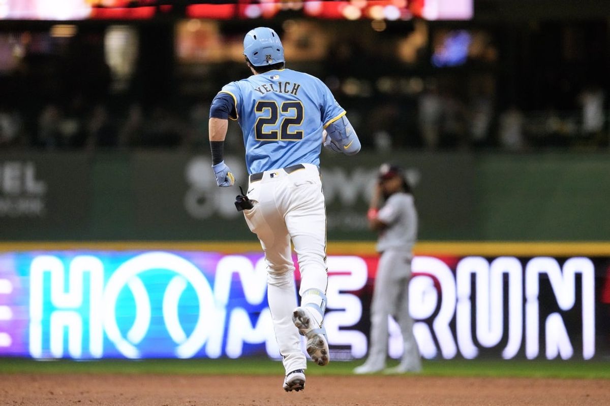 Jul 11, 2025; Milwaukee, Wisconsin, USA;  Milwaukee Brewers designated hitter Christian Yelich (22) rounds the bases after hitting a home run during the third inning against the Washington Nationals at American Family Field. Mandatory Credit: Jeff Hanisch-Imagn Images