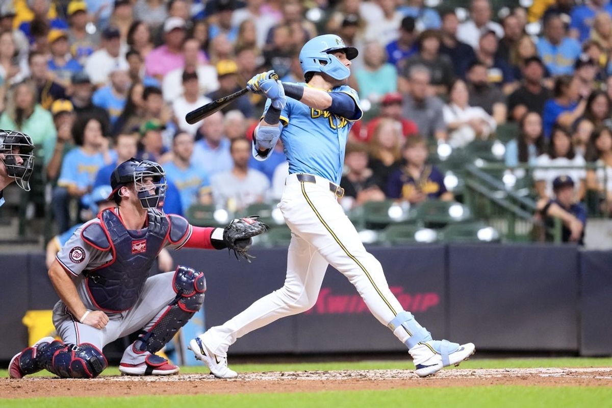 Jul 11, 2025; Milwaukee, Wisconsin, USA;  Milwaukee Brewers designated hitter Christian Yelich (22) hits a home run during the third inning against the Washington Nationals at American Family Field. Mandatory Credit: Jeff Hanisch-Imagn Images