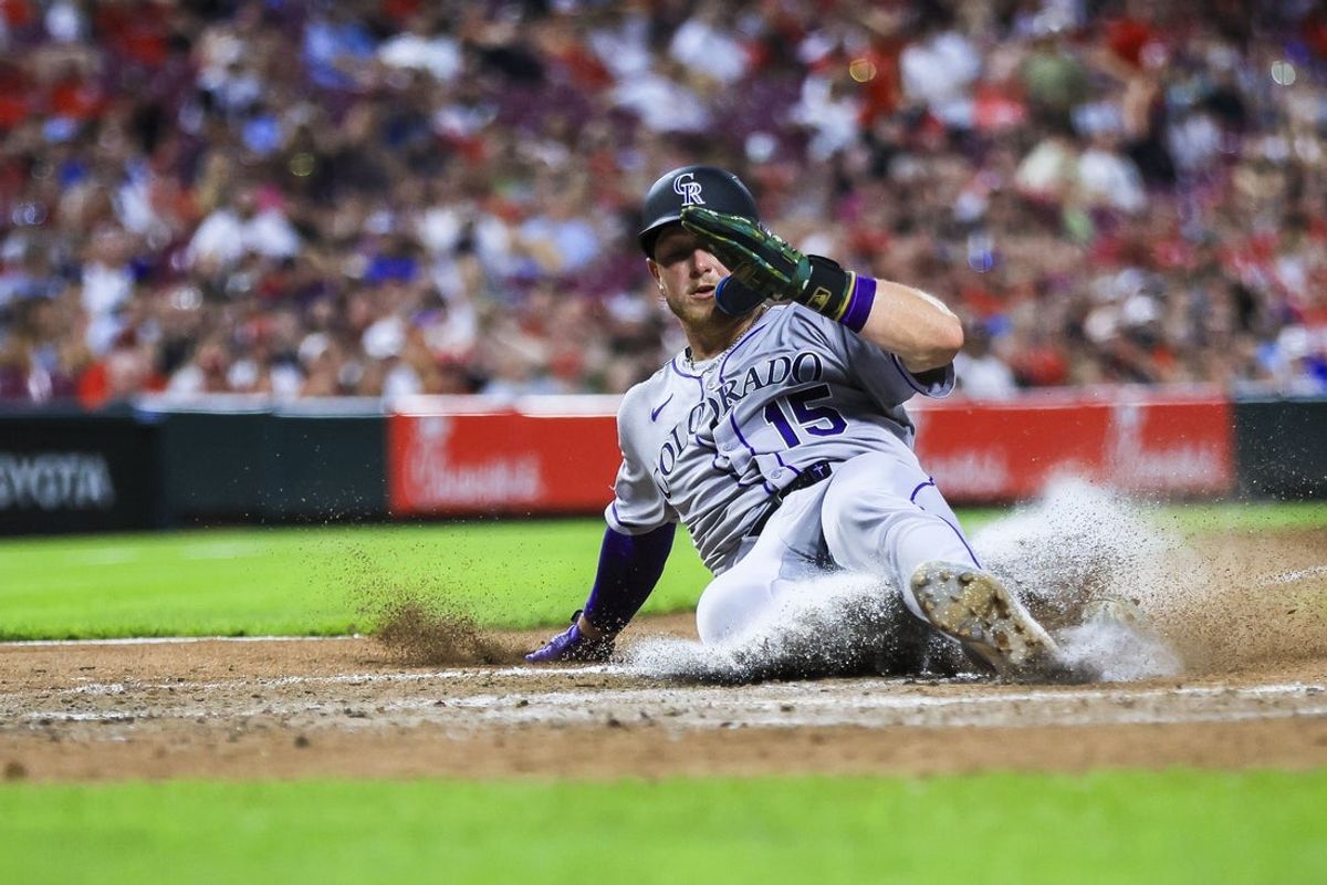 Jul 11, 2025; Cincinnati, Ohio, USA; Colorado Rockies catcher Hunter Goodman (15) scores on a wild pitch by Cincinnati Reds pitcher Tony Santillan (not pictured) in the eighth inning at Great American Ball Park. Mandatory Credit: Katie Stratman-Imagn Images