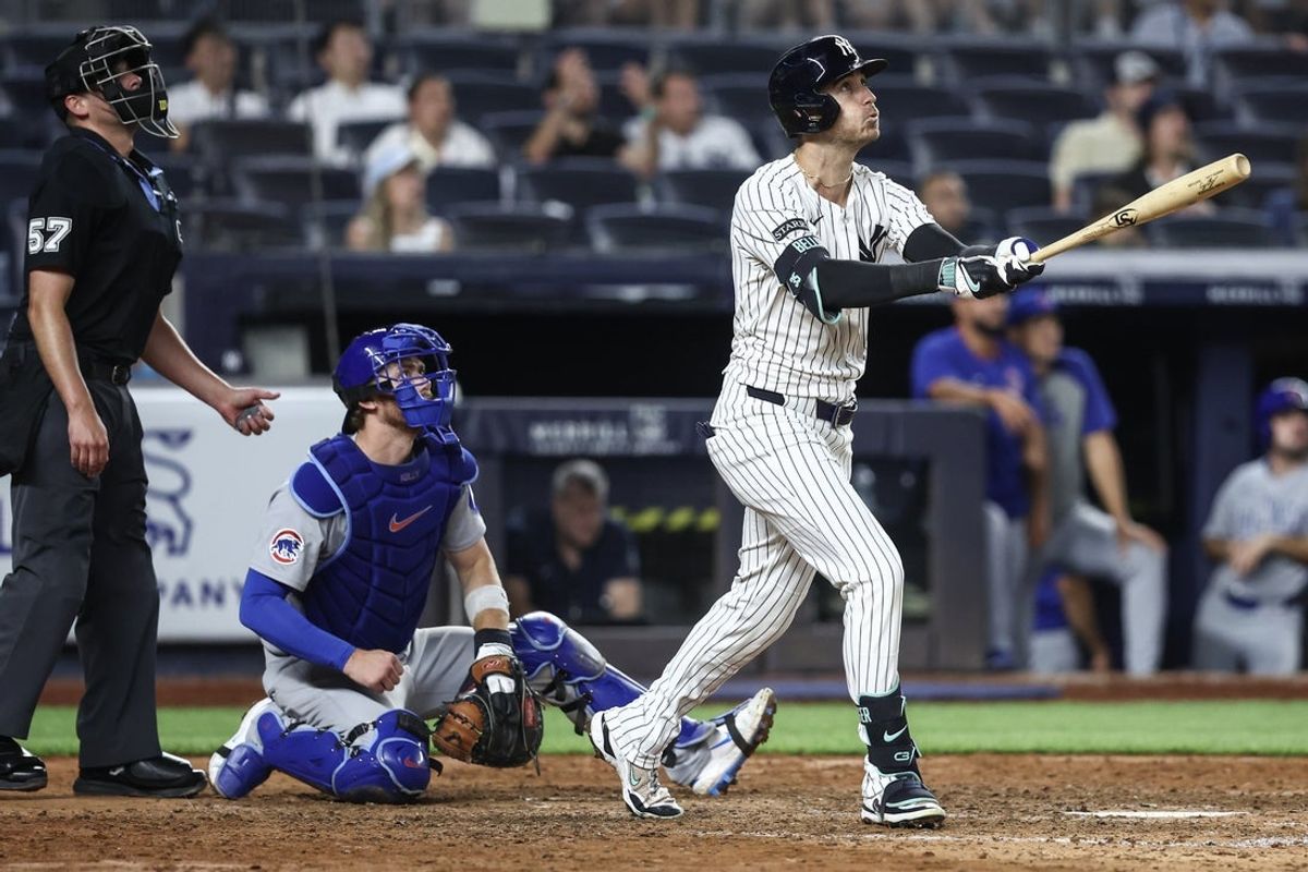 Jul 11, 2025; Bronx, New York, USA;  New York Yankees center fielder Cody Bellinger (35) hits a two run home run,  his third home run of the game, in the eighth inning against the Chicago Cubs at Yankee Stadium. Mandatory Credit: Wendell Cruz-Imagn Images