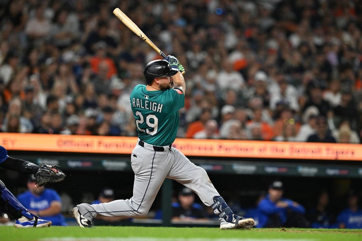 Jul 11, 2025; Detroit, Michigan, USA;  Seattle Mariners designated hitter Cal Raleigh (29) hits a grand slam home run against the Detroit Tigers in the ninth inning at Comerica Park. Mandatory Credit: Lon Horwedel-Imagn Images