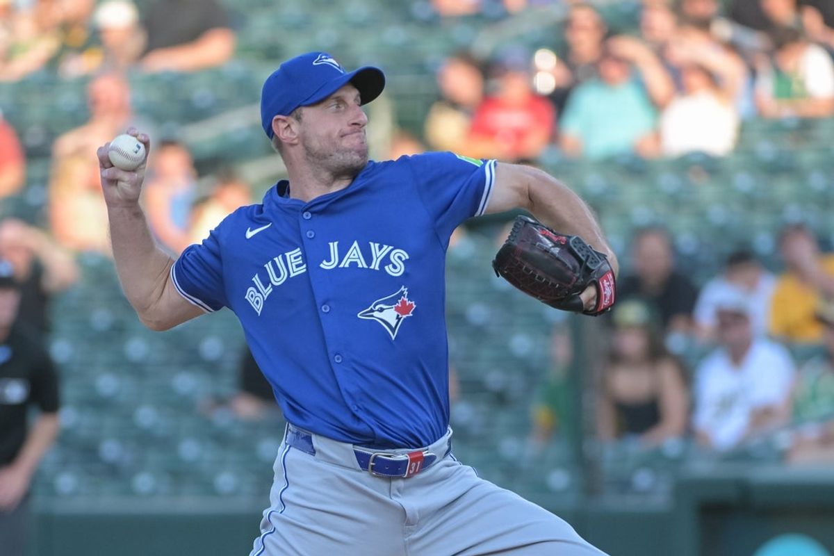 Jul 11, 2025; West Sacramento, California, USA; Toronto Blue Jays pitcher Max Scherzer (31) throws a pitch against the Athletics during the first inning at Sutter Health Park. Mandatory Credit: Ed Szczepanski-Imagn Images