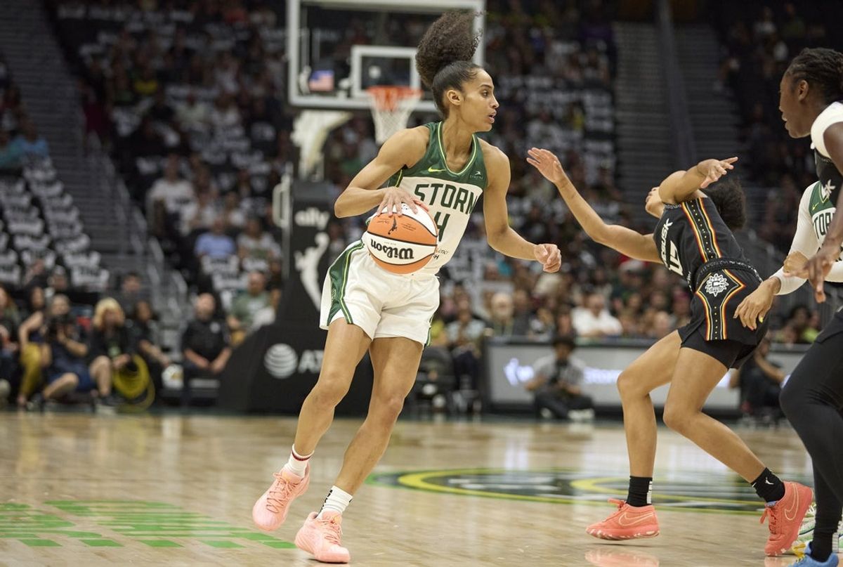 Jul 11, 2025; Seattle, Washington, USA; Seattle Storm guard Skylar Diggins (4) dribbles around Connecticut Sun guard Leila Lacan (47) during the first half at Climate Pledge Arena. Mandatory Credit: John Froschauer-Imagn Images
