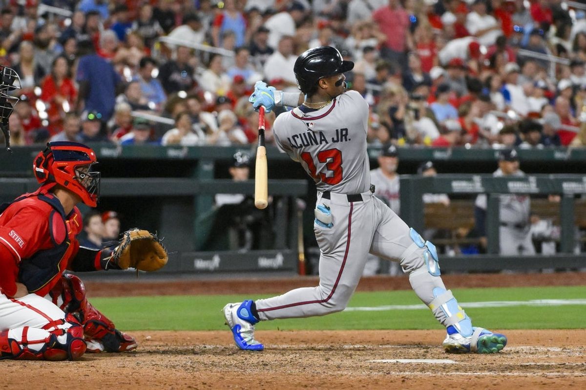 Jul 11, 2025; St. Louis, Missouri, USA;  Atlanta Braves right fielder Ronald Acuna Jr (13) hits a double against the St. Louis Cardinals during the ninth inning at Busch Stadium. Mandatory Credit: Jeff Curry-Imagn Images