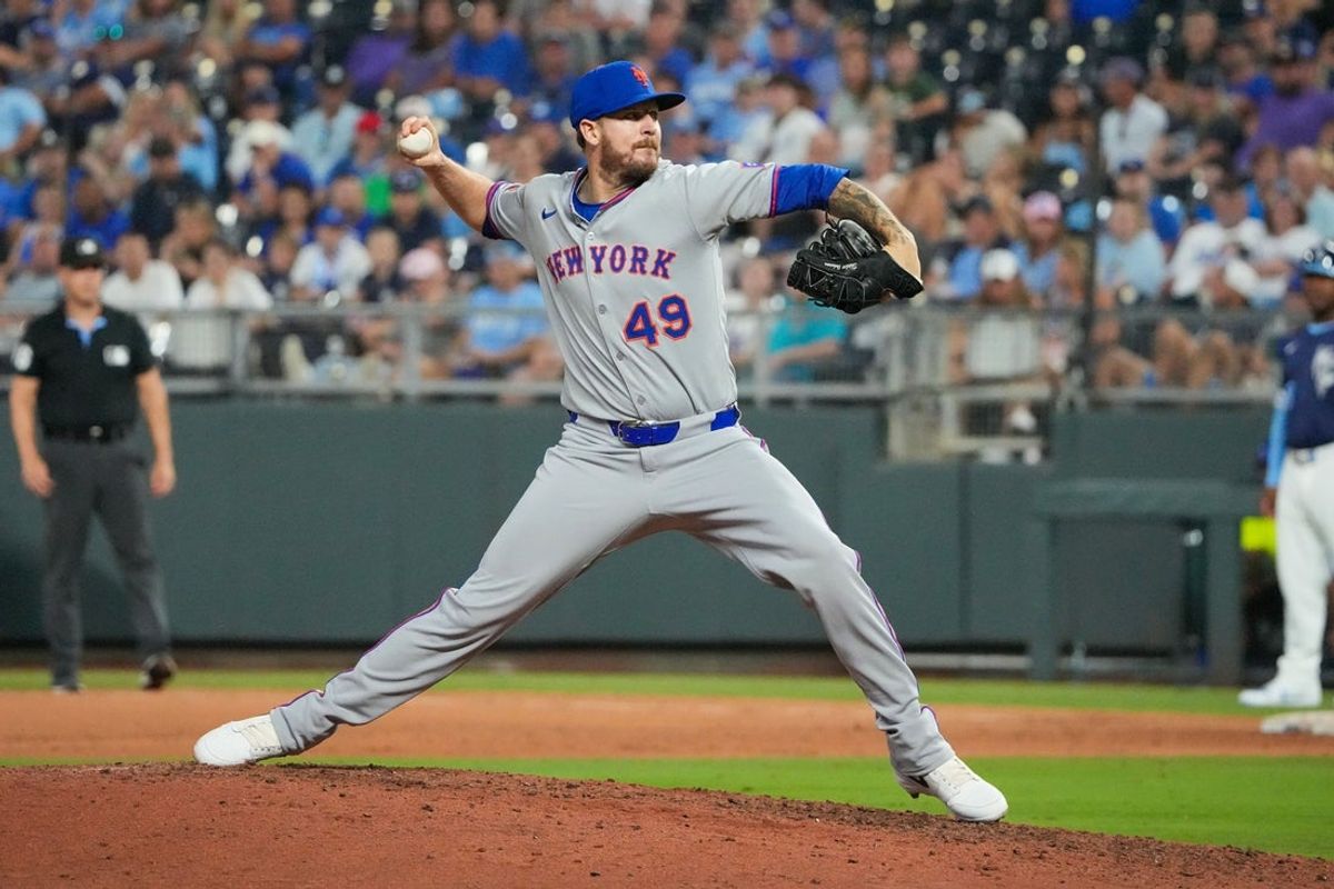 Jul 11, 2025; Kansas City, Missouri, USA; New York Mets relief pitcher Chris Devenski (49) delivers a pitch against the Kansas City Royals in the ninth inning at Kauffman Stadium. Mandatory Credit: Denny Medley-Imagn Images