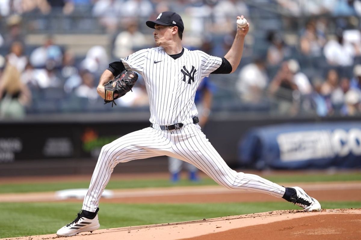 Jul 12, 2025; Bronx, New York, USA; New York Yankees pitcher Max Fried (54) delivers a pitch against the Chicago Cubs during the first inning at Yankee Stadium. Mandatory Credit: Gregory Fisher-Imagn Images