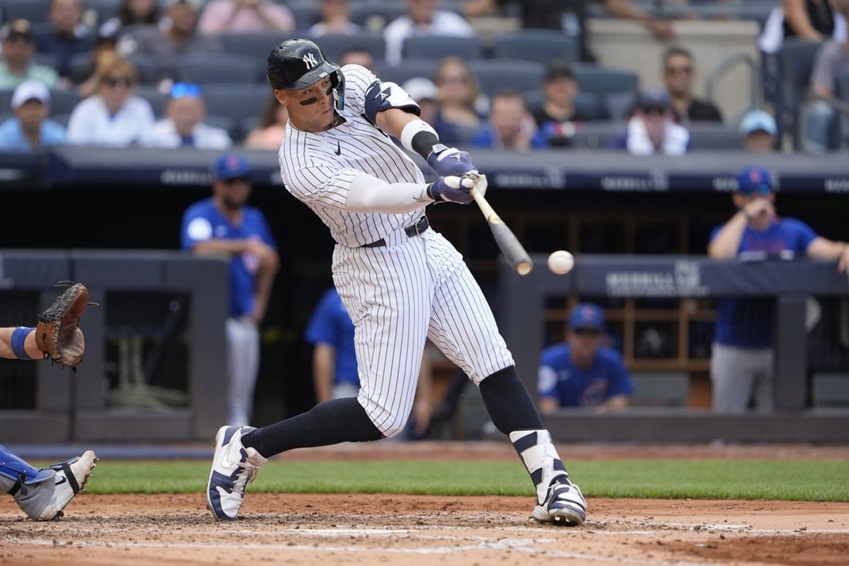 Jul 12, 2025; Bronx, New York, USA; New York Yankees right fielder Aaron Judge (99) hits a double during the fourth inning at Yankee Stadium. Mandatory Credit: Gregory Fisher-Imagn Images
