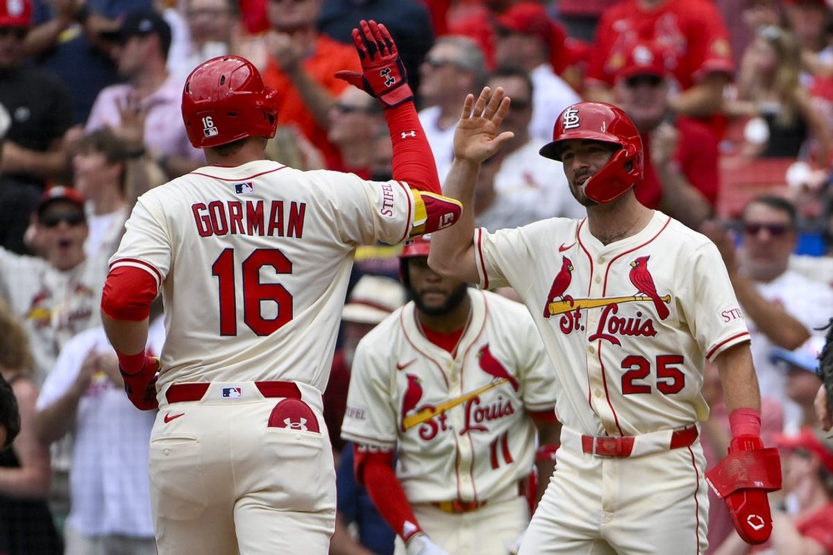 Jul 12, 2025; St. Louis, Missouri, USA;  St. Louis Cardinals designated hitter Nolan Gorman (16) is congratulated by third baseman Thomas Saggese (25) after hitting a two run home run against the Atlanta Braves during the second inning at Busch Stadium. Mandatory Credit: Jeff Curry-Imagn Images