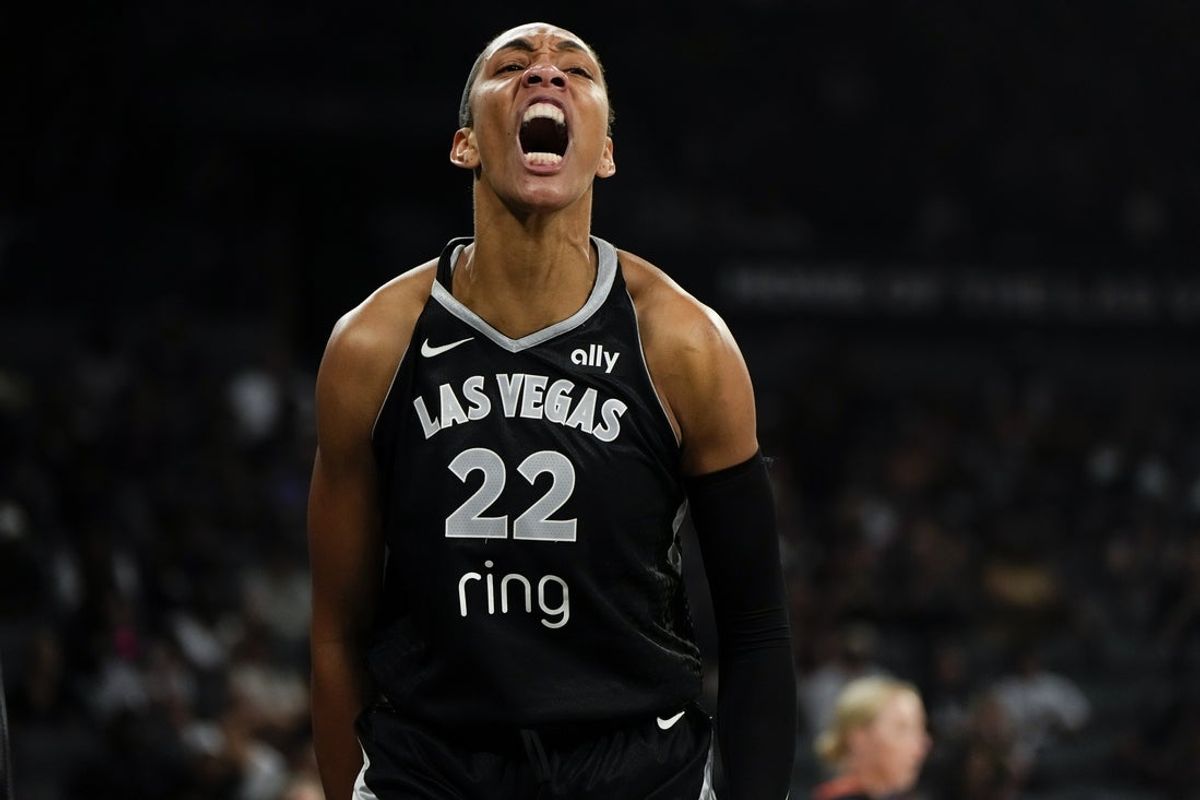 Jul 12, 2025; Las Vegas, Nevada, USA; Las Vegas Aces center A'ja Wilson (22) reacts after scoring against the Golden State Valkyries during the first half of a WNBA basketball game at Michelob Ultra Arena. Mandatory Credit: Lucas Peltier-Imagn Images