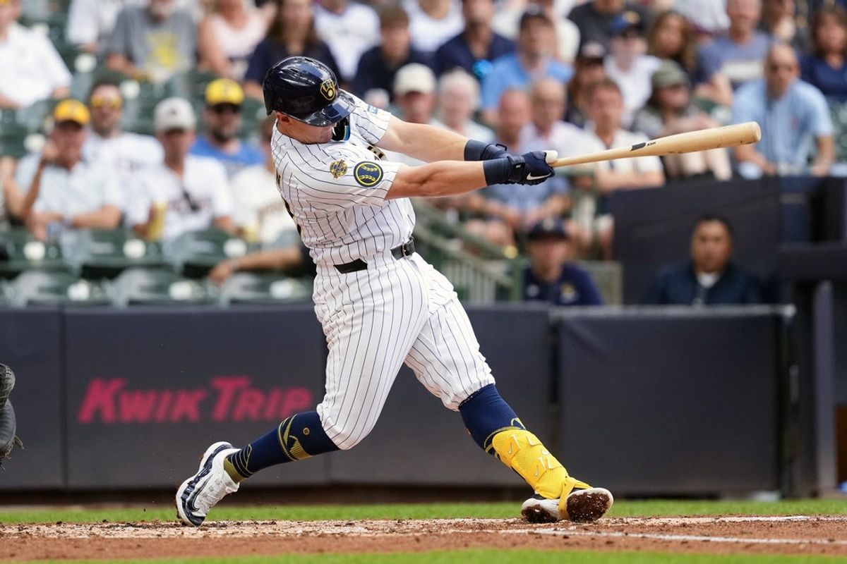 Jul 12, 2025; Milwaukee, Wisconsin, USA;  Milwaukee Brewers first baseman Andrew Vaughn (28) hits an RBI double during the fourth inning against the Washington Nationals at American Family Field. Mandatory Credit: Jeff Hanisch-Imagn Images