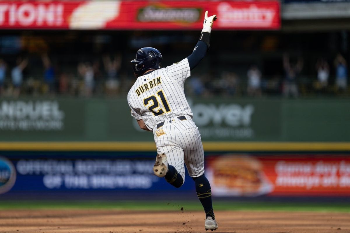 Jul 12, 2025; Milwaukee, Wisconsin, USA;  Milwaukee Brewers third baseman Caleb Durbin (21) celebrates after driving in the game winning run during the ninth inning against the Washington Nationals at American Family Field. Mandatory Credit: Jeff Hanisch-Imagn Images