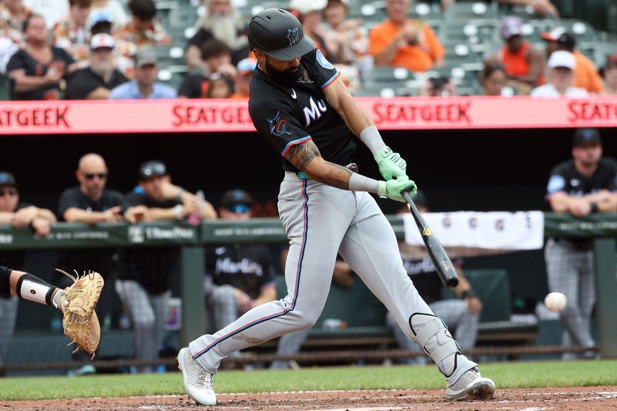 Jul 12, 2025; Baltimore, Maryland, USA; Miami Marlins outfielder Derek Hill (3) hits an RBI single during the seventh inning against the Baltimore Orioles at Oriole Park at Camden Yards. Mandatory Credit: Daniel Kucin Jr.-Imagn Images