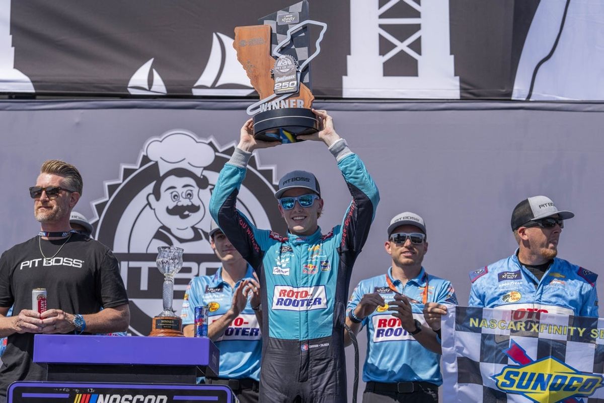 Jul 12, 2025; Sonoma, California, USA;  NASCAR Xfinity Series driver Connor Zilisch (88) celebrates after winning the NASCAR Xfinity Series at Sonoma Raceway. Mandatory Credit: Stan Szeto-Imagn Images