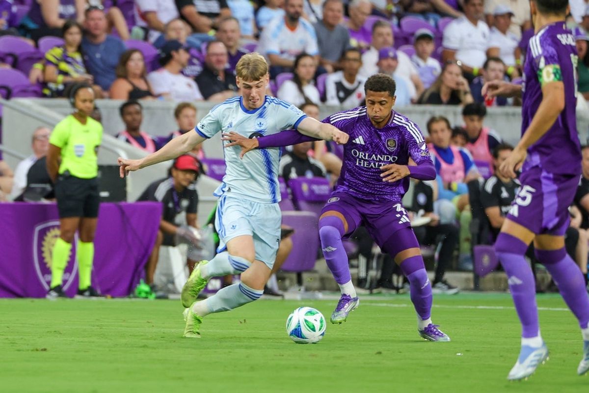 Jul 12, 2025; Orlando, Florida, USA; CF Montréal midfielder Hennadiy Synchuk (18) battles for the ball against Orlando City defender Rafael Santos (3) during the first half at Inter&Co Stadium. Mandatory Credit: Mike Watters-Imagn Images