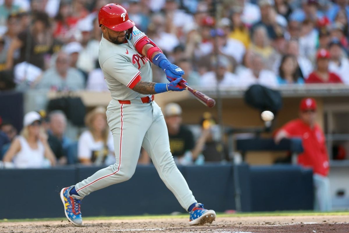 Jul 12, 2025; San Diego, California, USA; Philadelphia Phillies third baseman Edmundo Sosa (33) hits a two-run single during the fifth inning against the San Diego Padres at Petco Park. Mandatory Credit: David Frerker-Imagn Images