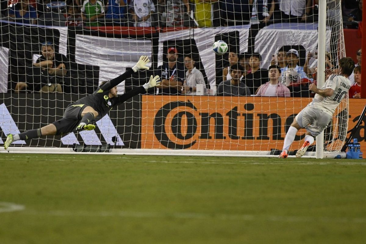 Jul 12, 2025; Chicago, Illinois, USA;  San Diego FC midfielder Anders Dreyer (10) scores a goal past Chicago Fire goalkeeper Chris Brady (1) during the first half at Soldier Field. Mandatory Credit: Matt Marton-Imagn Images