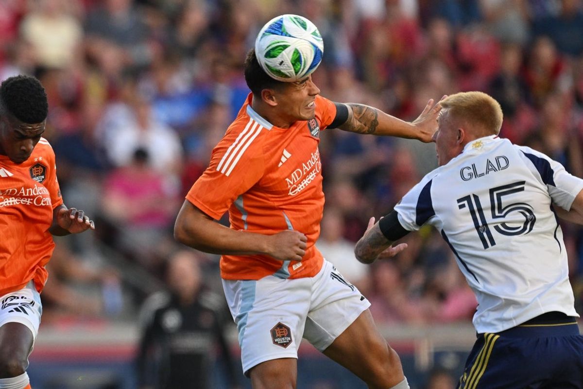 Jul 12, 2025; Sandy, Utah, USA;  Houston Dynamo FC forward Ezequiel Ponce (10) heads the ball in the first half against Real Salt Lake at America First Field. Mandatory Credit: Jamie Sabau-Imagn Images