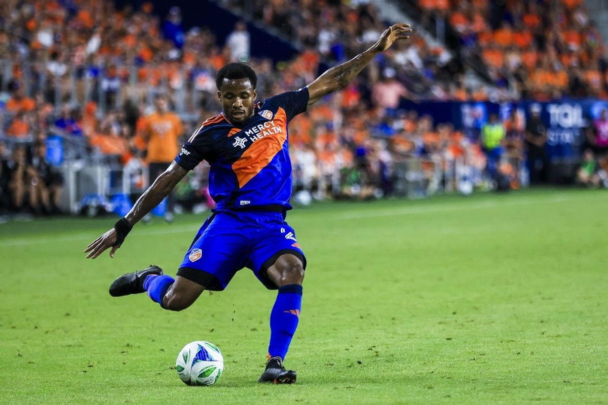 Jul 12, 2025; Cincinnati, Ohio, USA; FC Cincinnati defender Alvas Powell (2) kicks the ball against the Columbus Crew in the second half at TQL Stadium. Mandatory Credit: Katie Stratman-Imagn Images