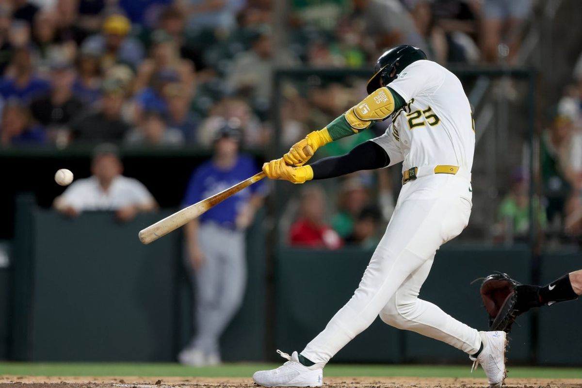 Jul 12, 2025; West Sacramento, California, USA; Athletics designated hitter Brent Rooker (25) hits a two run home run against the Toronto Blue Jays during the fifth inning at Sutter Health Park. Mandatory Credit: Dennis Lee-Imagn Images