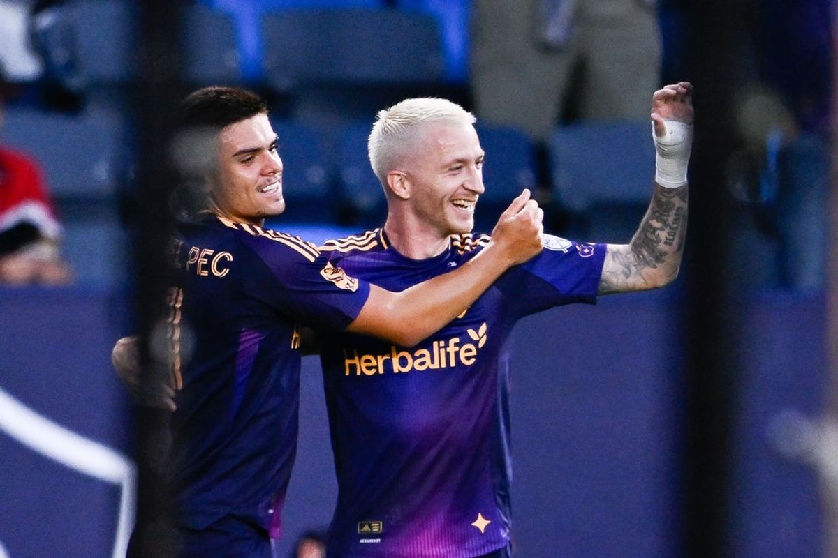 Jul 12, 2025; Carson, California, USA; LA Galaxy midfielder Marco Reus (18) celebrates his goal with forward Gabriel Pec  (11)  during the first half against D.C. United at Dignity Health Sports Park. Mandatory Credit: Kelvin Kuo-Imagn Images