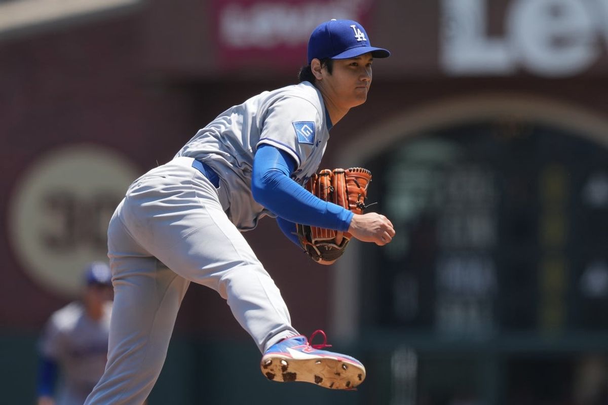 Jul 12, 2025; San Francisco, California, USA; Los Angeles Dodgers starting pitcher Shohei Ohtani (17) throws a pitch against the San Francisco Giants during the first inning at Oracle Park. Mandatory Credit: Darren Yamashita-Imagn Images