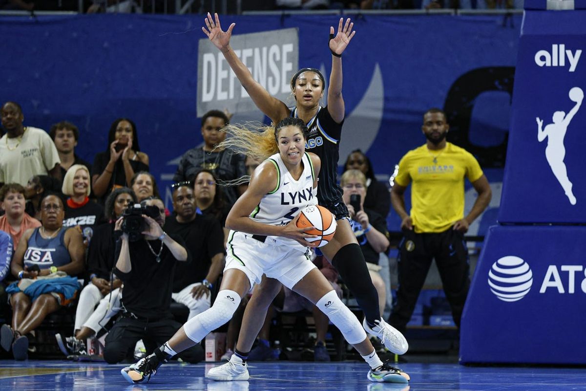 Jul 12, 2025; Chicago, Illinois, USA; Chicago Sky forward Angel Reese (5) defends against Minnesota Lynx forward Napheesa Collier (24) during the second half of a WNBA game at Wintrust Arena. Mandatory Credit: Kamil Krzaczynski-Imagn Images