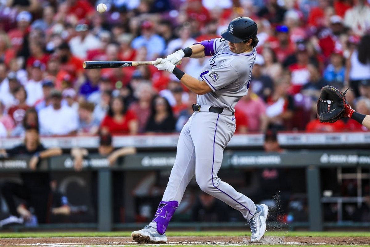 Jul 11, 2025; Cincinnati, Ohio, USA; Colorado Rockies first baseman Michael Toglia (4) bats against the Cincinnati Reds in the second inning at Great American Ball Park. Mandatory Credit: Katie Stratman-Imagn Images