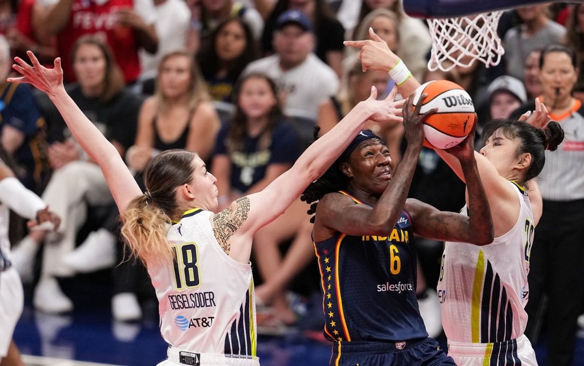 Indiana Fever forward Natasha Howard (6) goes in for a lay-up against Dallas Wings center Luisa Geiselsoder (18) on Sunday, July 13, 2025, during the game at Gainbridge Fieldhouse in Indianapolis.