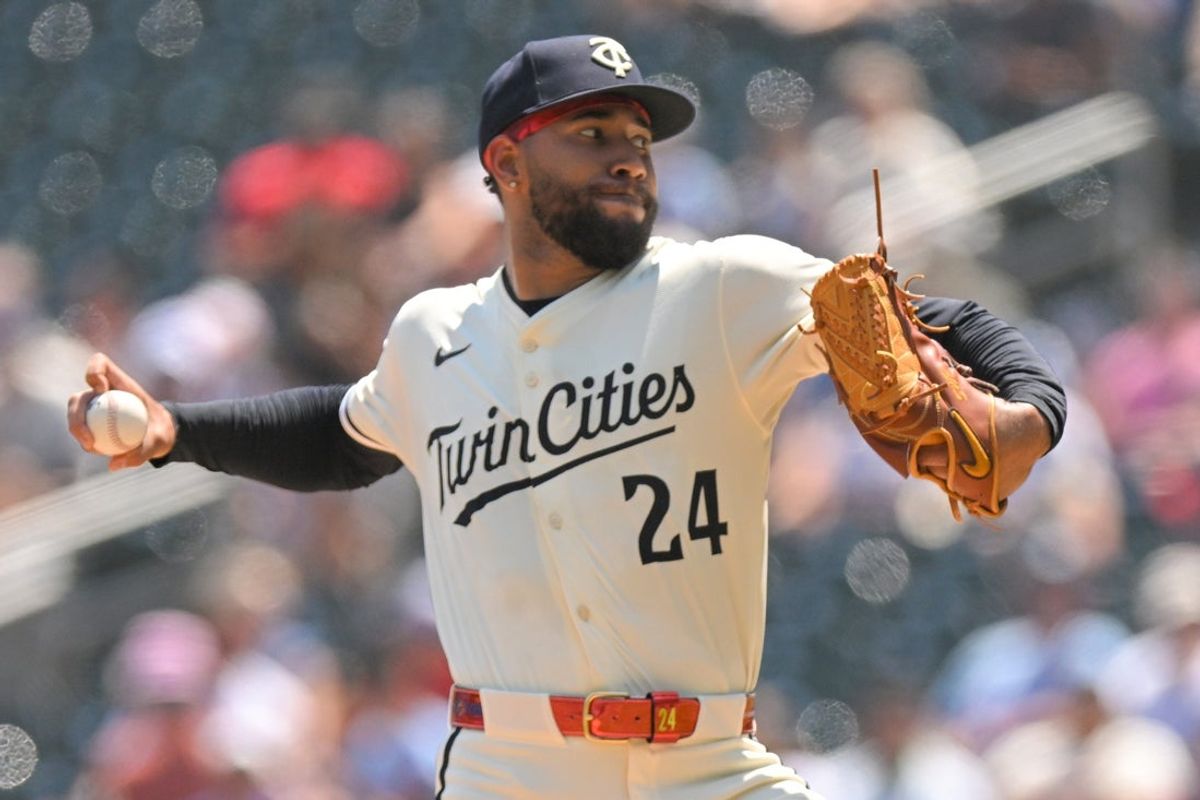 Jul 13, 2025; Minneapolis, Minnesota, USA;  Minnesota Twins starting pitcher Simeon Woods Richardson (24) delivers a pitch against the Pittsburgh Pirates during the third inning at Target Field. Mandatory Credit: Nick Wosika-Imagn Images