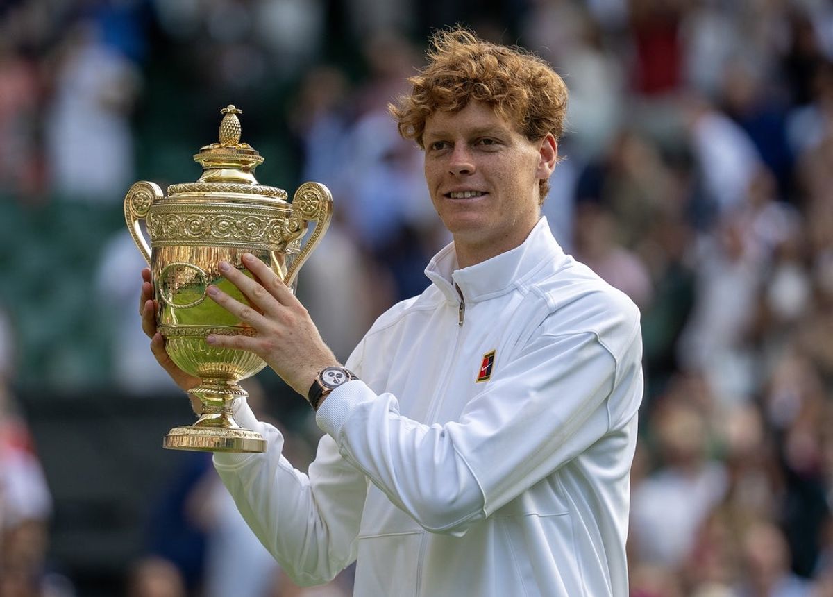 Jul 13, 2025; Wimbledon, United Kingdom; Jannik Sinner of Italy poses with the trophy after winning the men’s singles final match against Carlos Alcaraz of Spain on day 14 at All England Lawn Tennis and Croquet Club. Mandatory Credit: Susan Mullane-Imagn Images