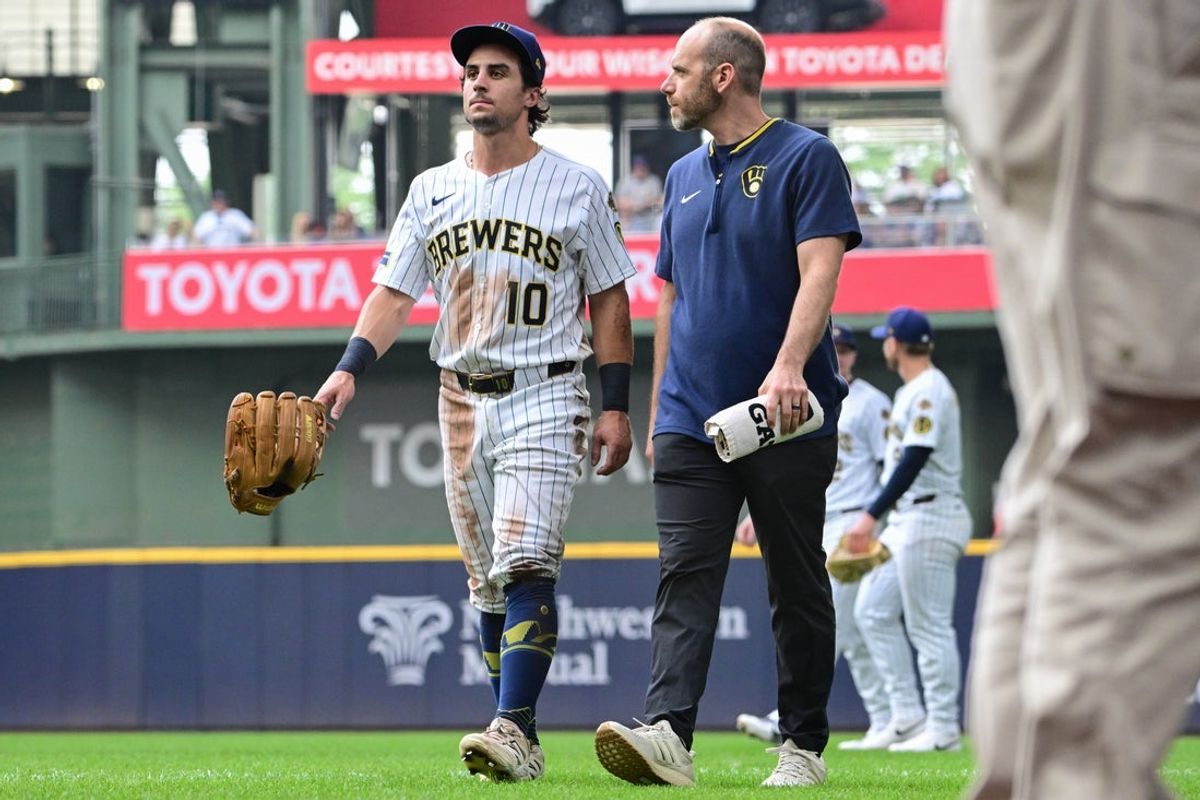 Jul 13, 2025; Milwaukee, Wisconsin, USA; Milwaukee Brewers right fielder Sal Frelick (10) leaves the game after an injury in the third inning against the Washington Nationals at American Family Field. Mandatory Credit: Benny Sieu-Imagn Images