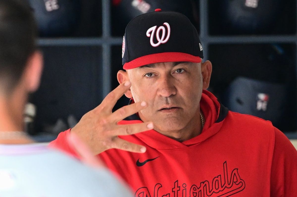 Jul 13, 2025; Milwaukee, Wisconsin, USA;  Washington Nationals interim manager Miguel Cairo talks to players before the game against the Milwaukee Brewers at American Family Field. Mandatory Credit: Benny Sieu-Imagn Images