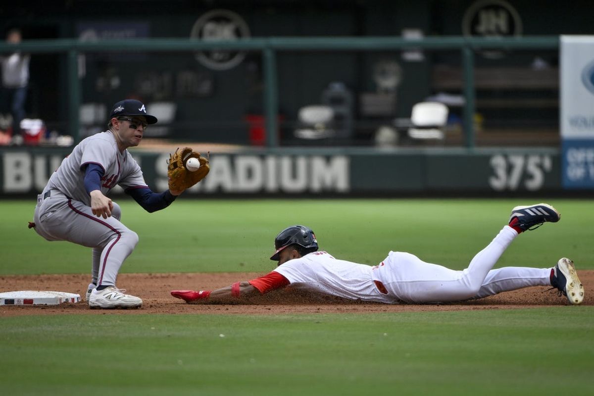 Jul 13, 2025; St. Louis, Missouri, USA;  St. Louis Cardinals center fielder Victor Scott II (11) steals second base against Atlanta Braves shortstop Nick Allen (2) during the second inning at Busch Stadium. Mandatory Credit: Jeff Curry-Imagn Images