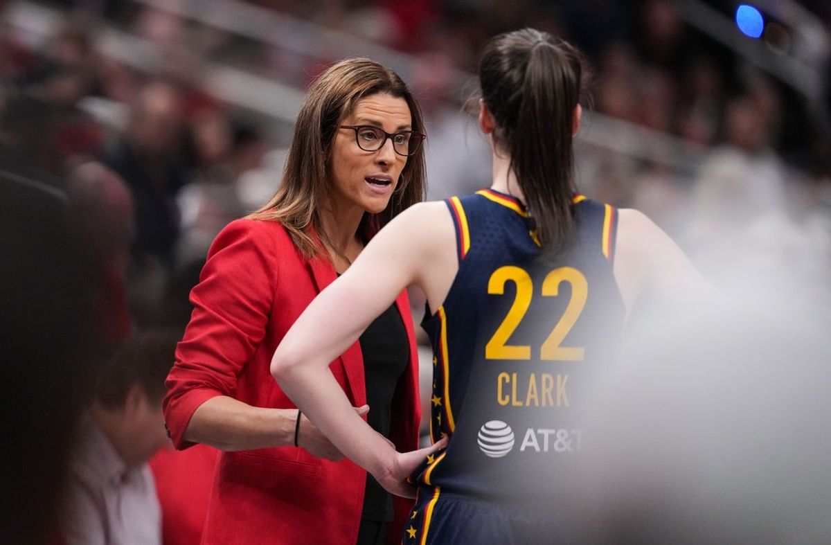 Indiana Fever guard Caitlin Clark (22) talks to Indiana Fever head coach Stephanie White on Sunday, July 13, 2025, during the game at Gainbridge Fieldhouse in Indianapolis.