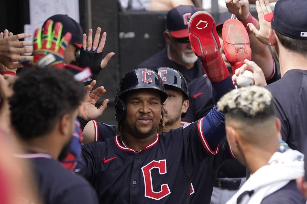 Jul 13, 2025; Chicago, Illinois, USA; Cleveland Guardians third base José Ramírez (11) is greeted in the dugout after scoring against the Chicago White Sox during the sixth inning at Rate Field. Mandatory Credit: David Banks-Imagn Images
