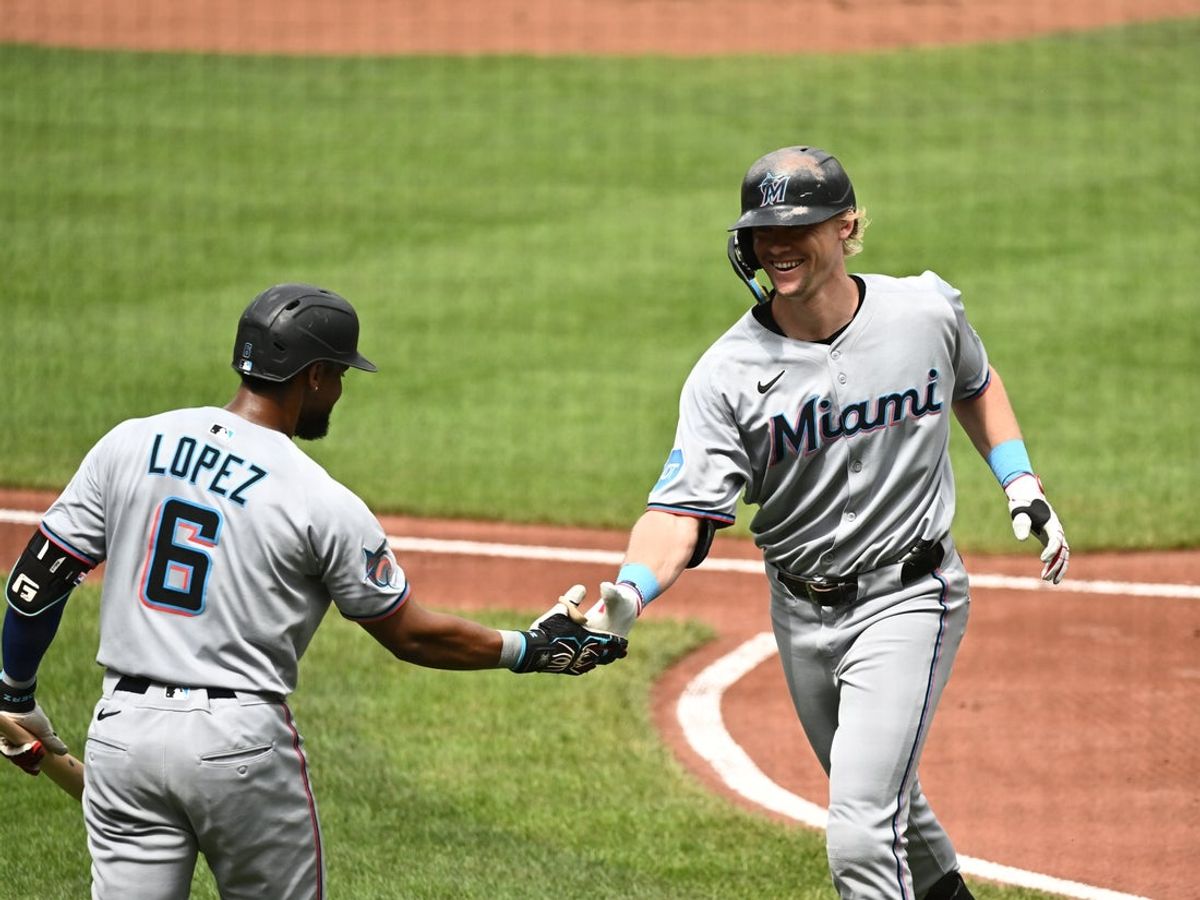 Jul 13, 2025; Baltimore, Maryland, USA;  Miami Marlins left fielder Kyle Stowers (28) celebrates hitting a home run with shortstop Otto Lopez (6) during the second inning against the Baltimore Orioles at Oriole Park at Camden Yards. Mandatory Credit: James A. Pittman-Imagn Images