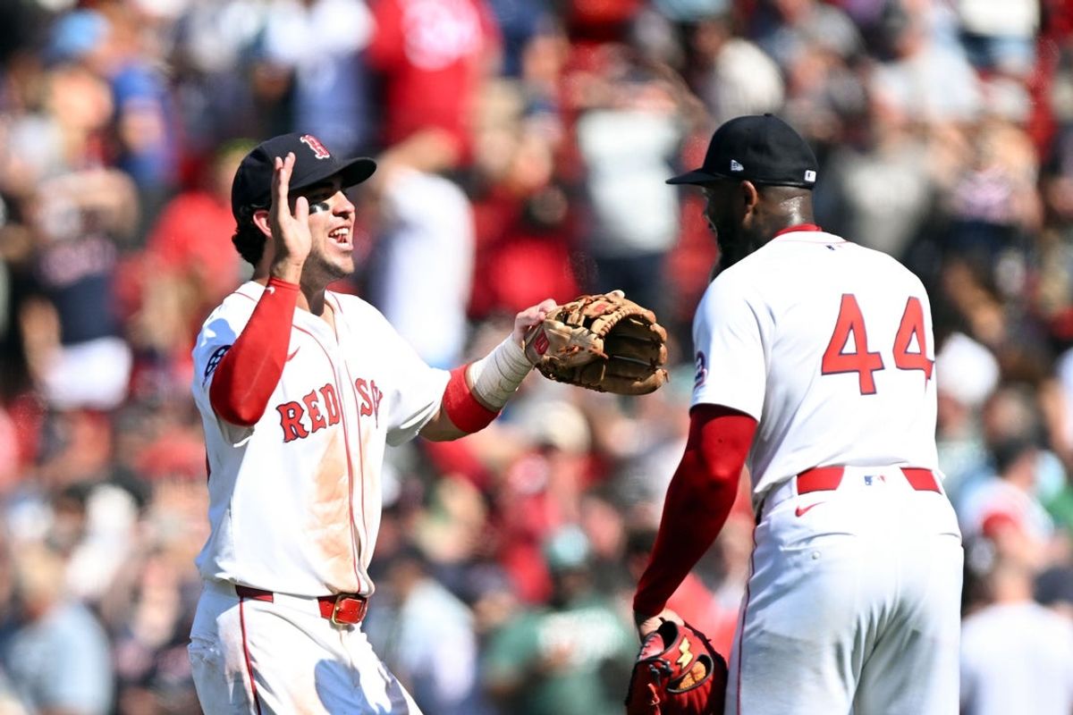 Jul 13, 2025; Boston, Massachusetts, USA; Boston Red Sox pitcher Aroldis Chapman (44) high-fives third base Marcelo Mayer (39) after a game against the Tampa Bay Rays at Fenway Park. Mandatory Credit: Brian Fluharty-Imagn Images