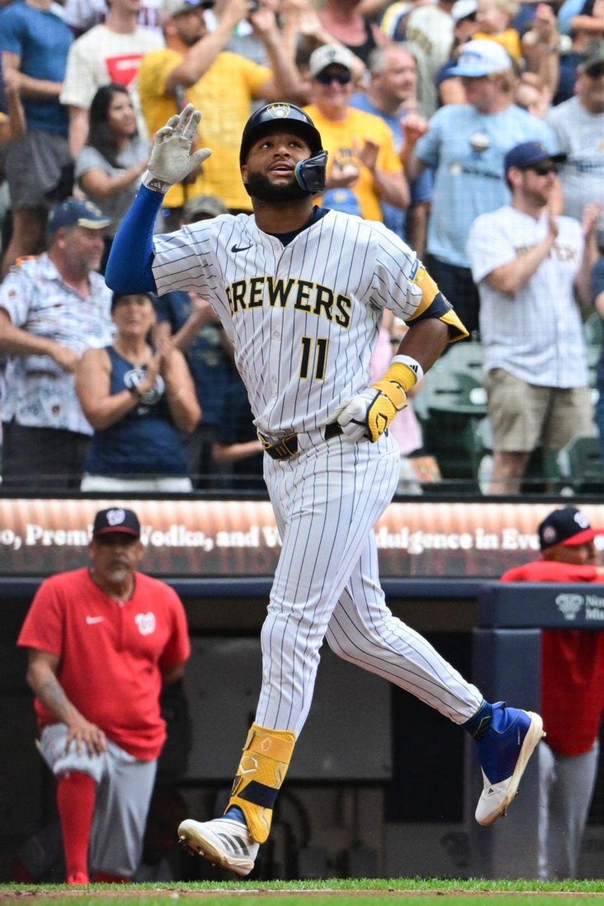 Jul 13, 2025; Milwaukee, Wisconsin, USA; Milwaukee Brewers center fielder Jackson Chourio (11) reacts after hitting a 3-run home run in the eighth inning against the Washington Nationals at American Family Field. Mandatory Credit: Benny Sieu-Imagn Images