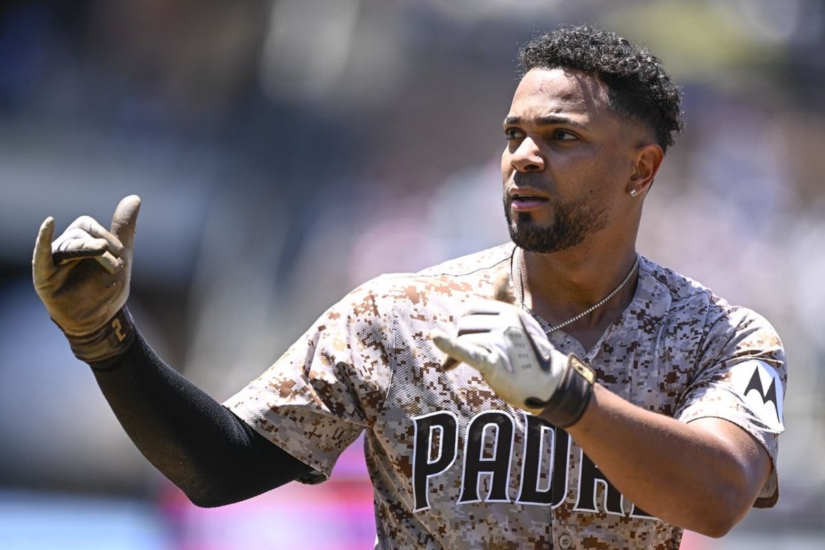 Jul 13, 2025; San Diego, California, USA; San Diego Padres shortstop Xander Bogaerts (2) gestures after hitting a single during the fourth inning against the against the Philadelphia Phillies at Petco Park. Mandatory Credit: Denis Poroy-Imagn Images
