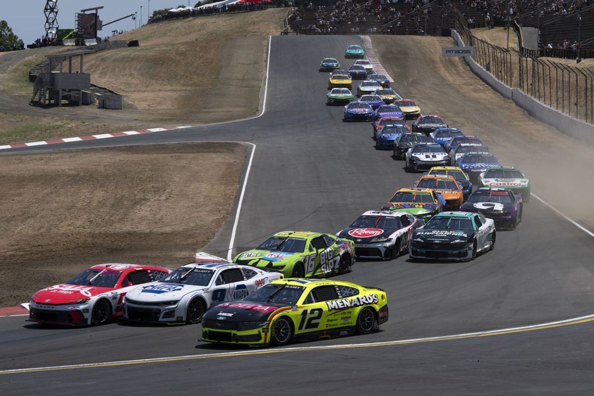 Jul 13, 2025; Sonoma, California, USA;  Drivers navigate around Turn 4 at Sonoma Raceway. Mandatory Credit: Stan Szeto-Imagn Images