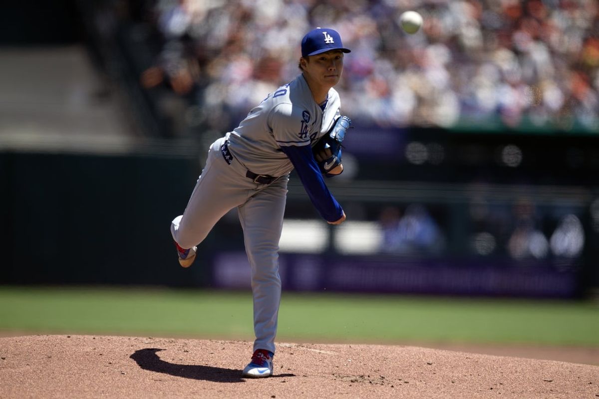 Jul 13, 2025; San Francisco, California, USA; Los Angeles Dodgers starting pitcher Yoshinobu Yamamoto (18) delivers a pitch against the San Francisco Giants during the first inning at Oracle Park. Mandatory Credit: D. Ross Cameron-Imagn Images