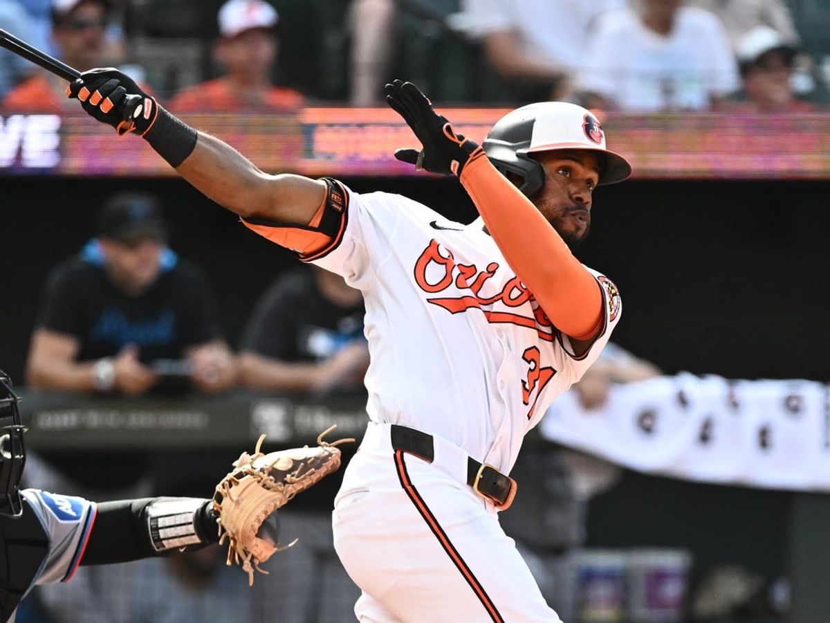 Jul 13, 2025; Baltimore, Maryland, USA;  Baltimore Orioles center fielder Cedric Mullins (31) singles during the sixth inning against the Miami Marlins at Oriole Park at Camden Yards. Mandatory Credit: James A. Pittman-Imagn Images